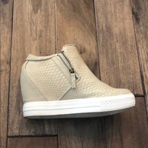 Cream colored wedge sneakers